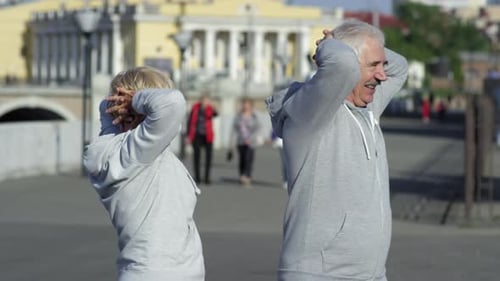 Elderly People Exercising Outdoors