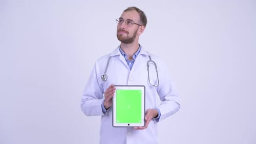 Doctor Holding Tablet with Green Screen Smiling