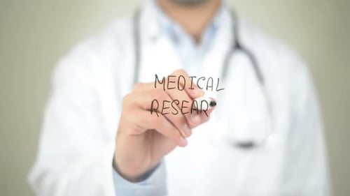 Doctor Writes Medical Research on Clear Surface