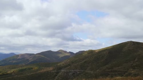 Green Mountain Pastures Panoramic Vista of Hills with Big White Fluffy Clouds in the Sky