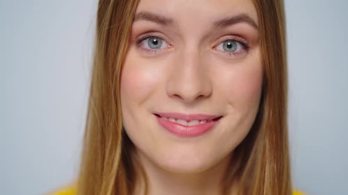 Smiling Young Woman's Face in Close Up Portrait