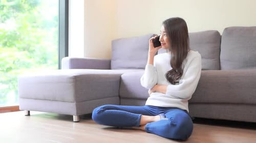 Woman Relaxing at Home Talking on Cell Phone