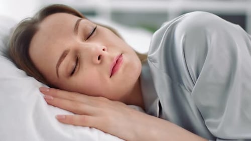 Close Up Adorable Face of Happy Girl Enjoying Dream Lying on Cosiness Cushion