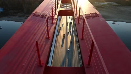The Flow of Cars is Filmed Through the Span of the Bridge