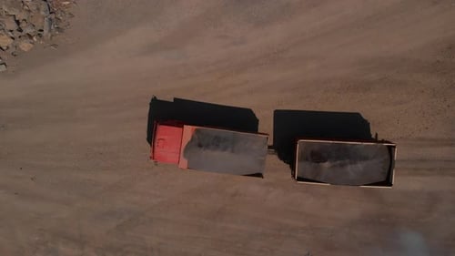 Dump Truck Transporting Gravel in an Openpit Mining Quarry