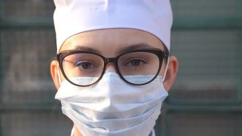 Close Up of Medical Professional Wearing Mask and Glasses