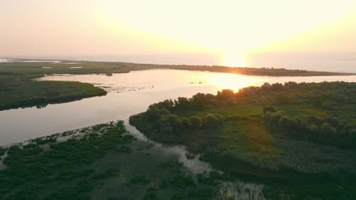 Beautiful Scenery of Wide River at Sunset with Reflection on Water