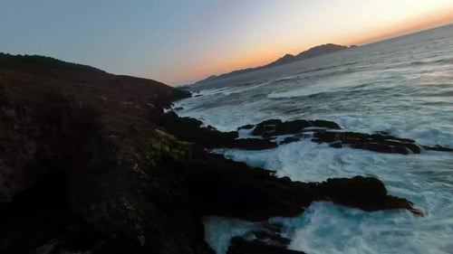 Rocky Coastline at Sunrise Aerial View