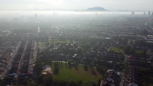 Aerial view mist morning fog at residential area