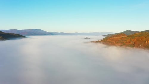Scenic Aerial View of Foggy Mountain Valley