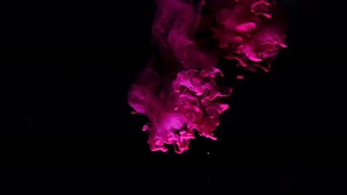 Magenta Ink Swirling on Black Background