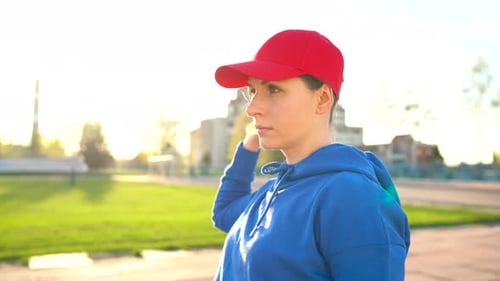 Woman Runs Through the Stadium at Sunset