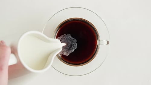 Black Tea with Milk in Cup Top View