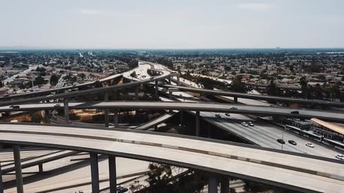 Drone Flying Right Over Amazing Freeway Junction with Cars Going Through Many Road Levels, Bridges