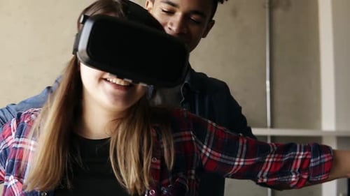 Couple Experiences Virtual Reality Together at Home