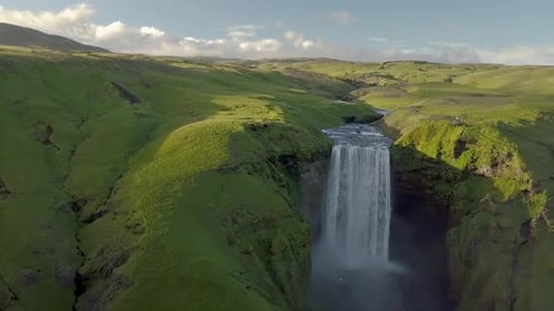 Flight over Skogafoss Waterfall in Green Iceland Nature