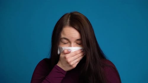 Woman Feeling Sick and Wearing Mask