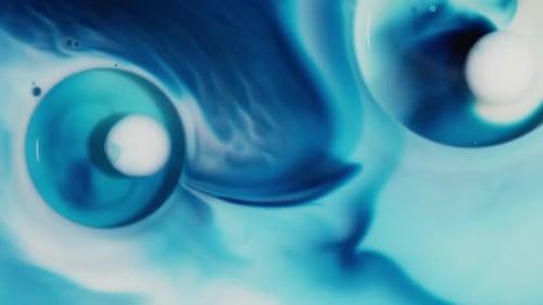 Abstract Blue and White Liquid with Suspended Orbs