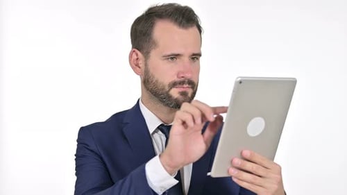 Serious Businessman Using Tablet, White Background