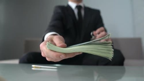 Businessman Receiving Money for Real Estate, Office for Rent or Sale, Investment