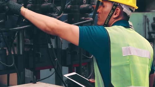 Smart Factory Worker Using Machine in Factory Workshop