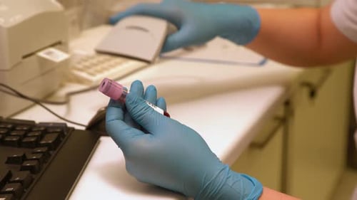 Scanning Blood Sample at Hospital Laboratory