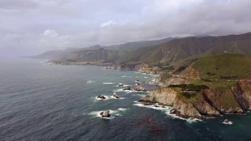 Beautiful Panoramic View of Rocky Coastline and Pacific Ocean Seascape at Overcast Weather