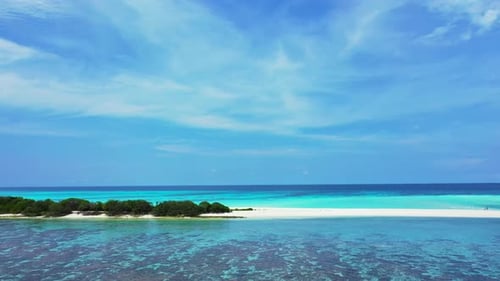 Paradise holiday scenery with tropical island cape of white sandy beach surrounded by calm turquoise