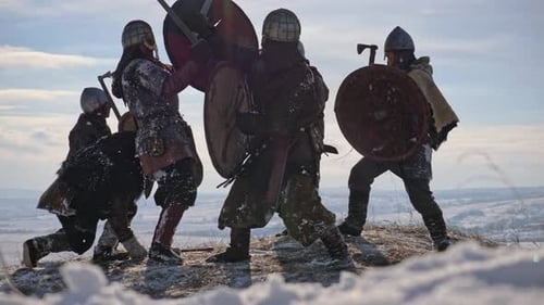 Warriors Battle on Snowy Hilltop in Winter
