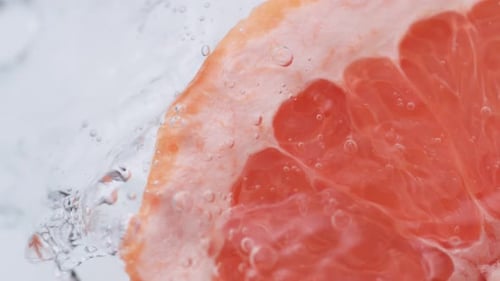 Grapefruit Slice Fresh in Water Close Up