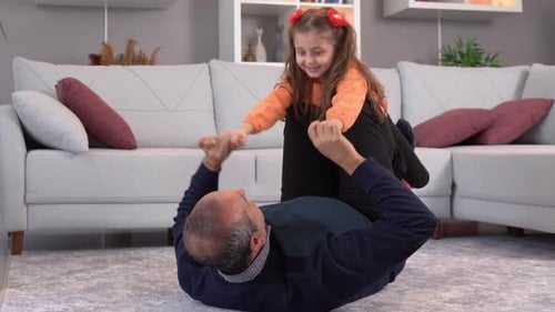 Father daughter play and mischief at home.