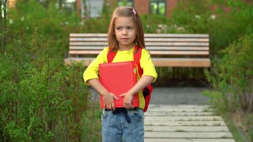 Smiling Young Girl Ready for School