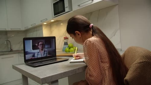 Girl Attends Online Class in Modern Kitchen