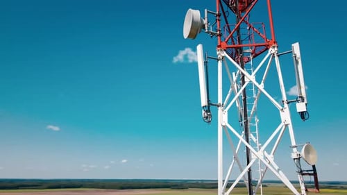 Aerial View of 4G and 5G Cell Tower with Antennas and Satellites