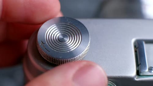 Macro Shot of Finger Turning Camera Dial
