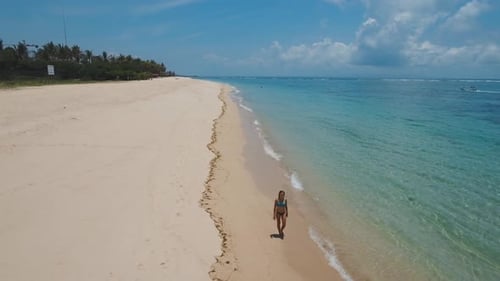 Girl Walking on the Beach