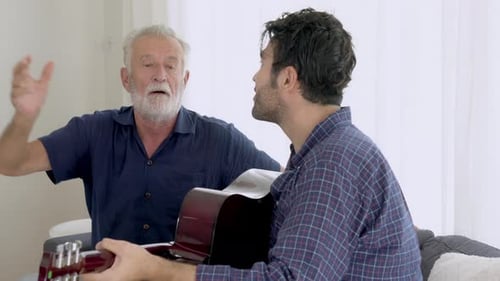 Man Playing Guitar with Senior Companion