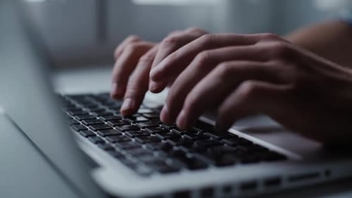 Mens Hands Are Typing on the Laptop Keyboard, Close-up.