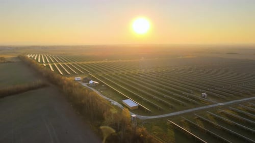 Aerial View of Big Sustainable Electric Power Plant with Many Rows of Solar Photovoltaic Panels for