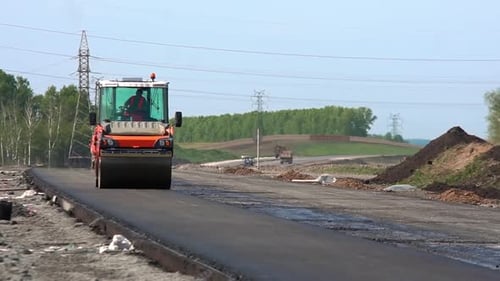 Road Roller Machine Rolling New Asphalt on Road