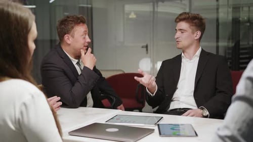 A company of office employees brainstorm together with the CEO of the company. creative process