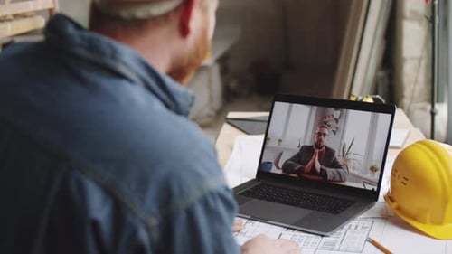Architect Having Online Meeting with Colleague on Video Call