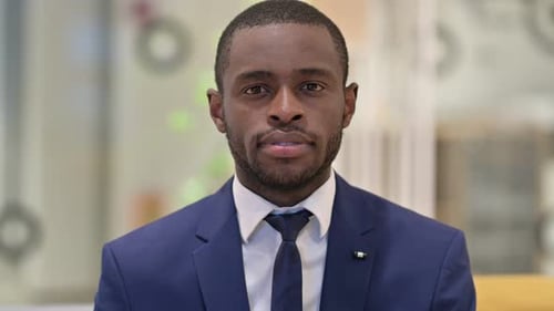 Serious Young Adult in a Suit Close Up