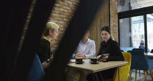 Business People Meeting in Cafe