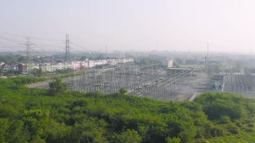 Aerial view of electricity generating, voltage poles. Power lines on utility tower and cable wires