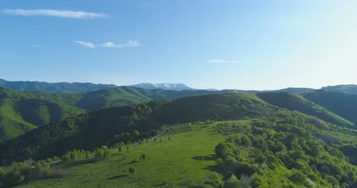 Green Meadows and Pastures in the Mountains Aerial Drone View