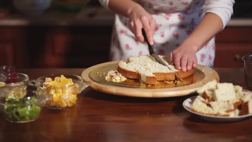 Woman Prepares Birthday Cake With Fruit In Kitchen