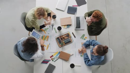 Top View of App Developers Discussing Project