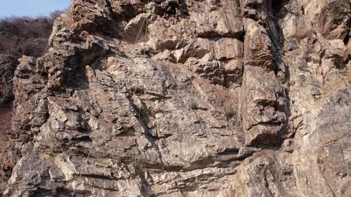 Rock Climbing Training on Steep Slope in Mountains