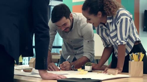 Creative Business People Group Having Conversation at Office Desk in Workplace